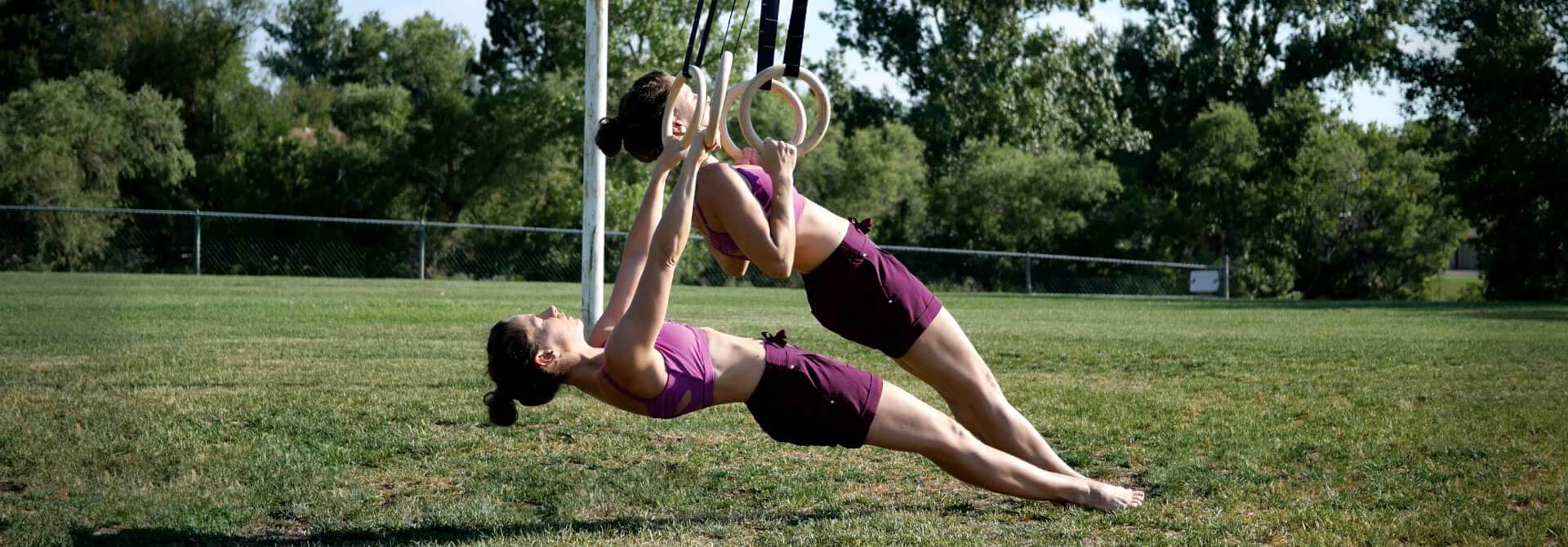 GymnasticBodies athlete perform ring rows. 