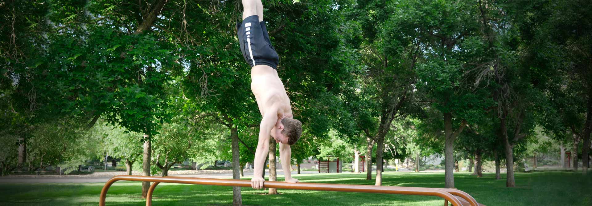 GymnasticBodies athlete shows confidence in his handstand.