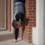 GymnasticBodies athlete shows off his handstand wall run strength.