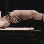 Bruce Lee performs a dragon flag, or body lever, for core strength.