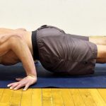 GymnasticBodies athlete demonstrates upper body and core control in a hollow back press.