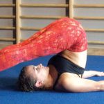 GymnasticBodies female athlete demonstrates a neck and trap stretch.