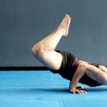 GymnasticBodies female athlete demonstrates core, shoulder, lat stability and strength with a straddle planche progression.