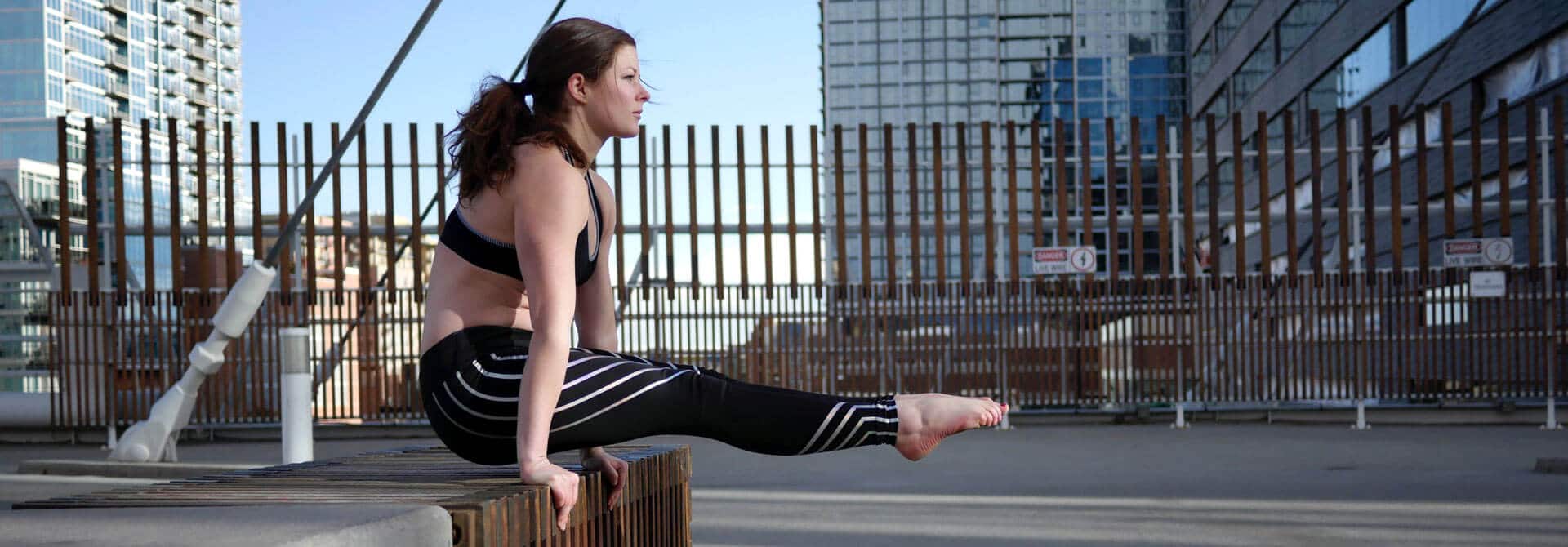 GymnasticBodies athlete shows off her core strength with an L-sit hold.